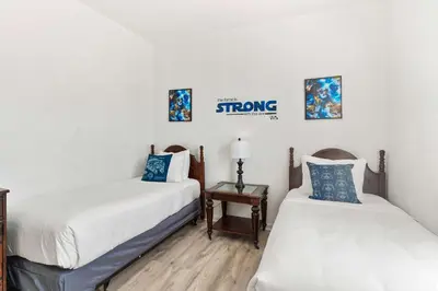 two beds in a room with white walls at 4814 Cayview Avenue 406 in Orlando