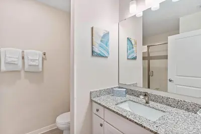 a bathroom with a sink and a mirror at 4012 Breakview Drive 110 in Orlando