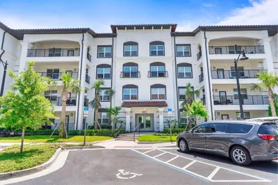 a car parked in a parking lot in front of a building at 4012 Breakview Drive 110 in Orlando