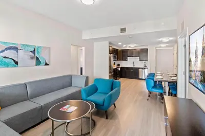 a living room with a couch and chairs and a table at 4012 Breakview Drive 210 in Orlando