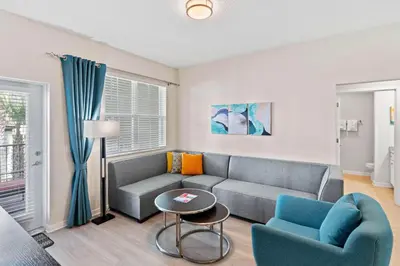 a living room with a couch and a table at 4012 Breakview Drive 210 in Orlando