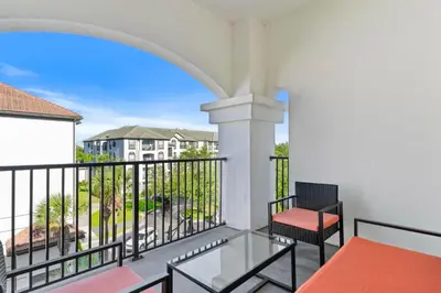 a balcony with a table and chairs and a view at 4012 Breakview Drive 410 in Orlando