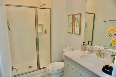 a bathroom with a shower and a toilet and a sink at Cozy & Magical place sleeps 12/10 min from Disney in Kissimmee