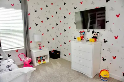 a childs bedroom with a wall covered in bats at Cozy & Magical place sleeps 12/10 min from Disney in Kissimmee