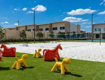 a group of wooden toy animals on the grass at Beautiful 4 suites - Close to Disney 7505 in Orlando