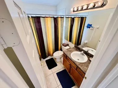 a bathroom with a sink and a toilet at Spacious, Open Layout And Pool Relaxation! in Orlando
