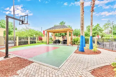 a basketball court with a gazebo and a basketball hoop at Family Friendly 1BR Suite with Swimming Pool - Near Disney in Orlando