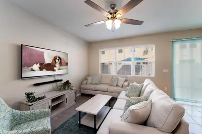a living room with a couch and a tv at Making Memories G in Kissimmee