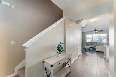 a hallway of a home with a staircase with a table at Making Memories G in Kissimmee