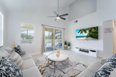 a living room with a couch and a table at Lakeview Villa G in Orlando