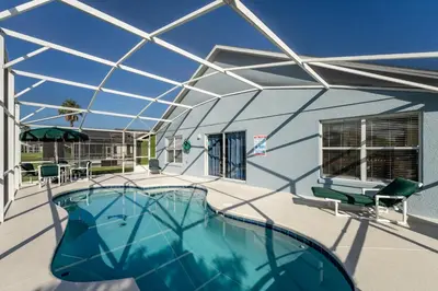 a roof over a swimming pool in a house at Eagle's End S in Kissimmee