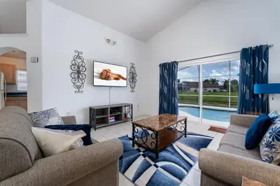 a living room with two couches and a table at Eagle's End S in Kissimmee