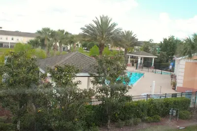 a view of a house with a swimming pool at 4 bedroom townhouse Sleeps 8 Coral Cay in Kissimmee