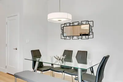 a dining room with a glass table and chairs at 4 bedrooms pool home Hidden Forest Resort Amenities in Orlando