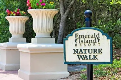 a sign in front of two vases on a wall at Lakeview w/8 Bedroom 5 KingSuite 3 miles to Disney in Kissimmee