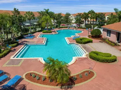 an overhead view of a swimming pool at a resort at 4732TH Cozy home in Kissimmee in Kissimmee