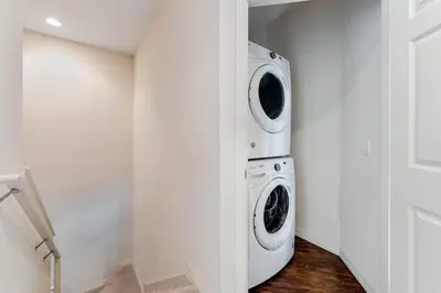 a laundry room with a washer and dryer at Disney Dream Resort Amenities Pool *4BD/3BA* Close to Parks in Kissimmee