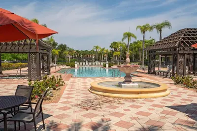 a fountain in the middle of a patio at Pool Townhouse near to Disney - Bella Vida Resort in Kissimmee