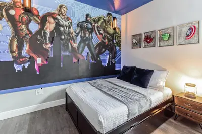 a bedroom with a superhero mural on the wall at Modern 5 BDR Family Themed Home with Harry Potter Games Room and Free Pool Heat in Orlando