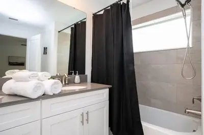 a bathroom with a sink and a shower at Gorgeous 4 Bedroom w Screened Pool Close to Disney 2653 in Kissimmee