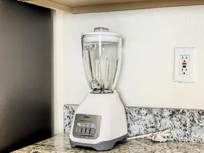 a blender sitting on top of a counter at Family pool home near Disney wBBQ grill in Orlando