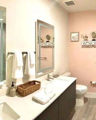 a bathroom with a sink and a toilet and a mirror at Like home, but better in Orlando