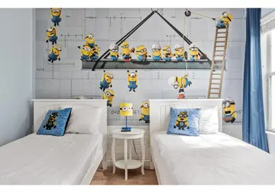 a room with two beds and a wall with a bunch of stuffed minions at Lakefront 5BR Resort Pool Home Near Disney World in Kissimmee