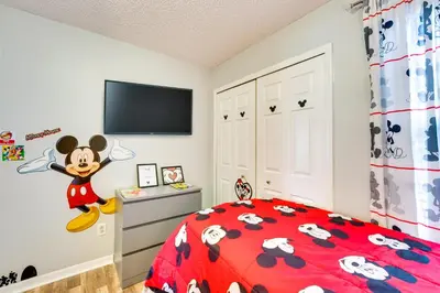 a childs bedroom with a mickey mouse bedroom at Kissimmee Vacation Rental - 5 Mi to Disney World! in Kissimmee