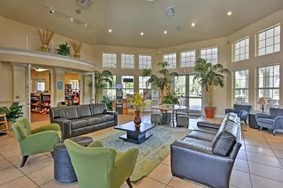 a large living room with couches and chairs at Kissimmee Vacation Rental with Pool about 4 Mi to Disney in Kissimmee