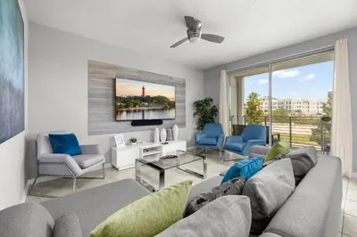 a living room with a couch and two chairs at Magic Condo 3BR at Storey Lake – 10 min to Disney in Kissimmee