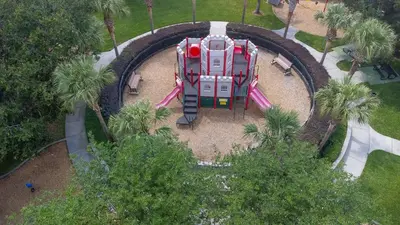 an aerial view of a roller coaster in a park at The Pink House at Windsor Hills in Orlando