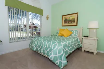 a bedroom with a bed and a window at Home With A View! in Orlando