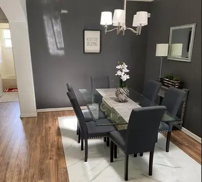 a dining room with a glass table and chairs at Just Wanna Have Sun! in Orlando