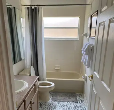 a bathroom with a tub and a toilet and a sink at Just Wanna Have Sun! in Orlando