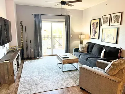 a living room with a couch and a table at Pirate Ship Resort Condo in Orlando