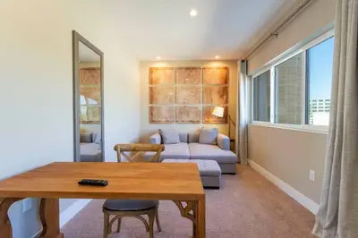 a living room with a couch and a table at Modern and Luxury 4 suites close to Disney 7544 in Orlando