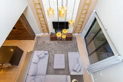 an overhead view of a living room with white furniture at Modern and Luxury 4 suites Villa near Disney 7521 in Orlando