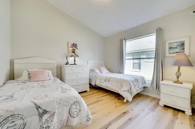 a bedroom with two beds and a window at 4 Mi to Disney Family Getaway with Game Room! in Kissimmee