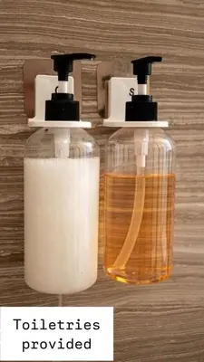 two bottles of soap sitting next to each other at Multiple Family Homes 16 Rooms - PoolSpa in Orlando