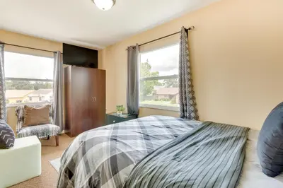 a bedroom with a bed and a window at 25 Mi to Disney Home with Shared Pool in Orlando in Orlando