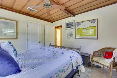 a bedroom with a bed and a ceiling fan at Near Kayak Launch Riverfront Home in Sanford! in Sanford
