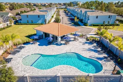 an aerial view of a pool at a resort at 7988 Magical 5BD Home Perfect Disney Retreat in Kissimmee