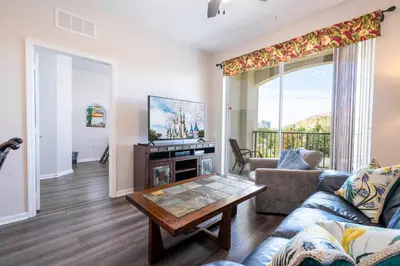 a living room with a couch and a table at Location Location Orlando Resort Near All Parks! Int'l Dr in Orlando