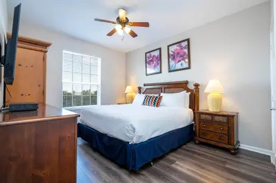 a bedroom with a bed and a flat screen tv at Location Location Orlando Resort Near All Parks! Int'l Dr in Orlando