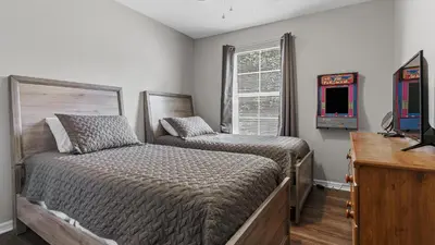 a bedroom with a bed and a video game at bsv_villa8445 in Kissimmee