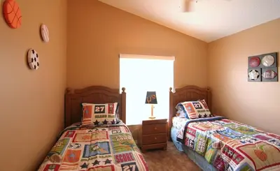a bedroom with two beds and a window at Emma Castle - private fenced home 3 miles to Disney in Kissimmee