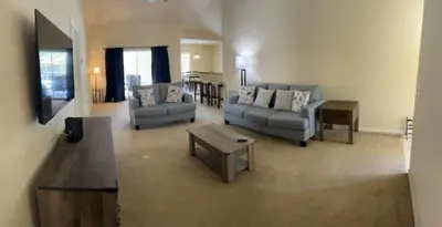 a living room with two couches and a coffee table at 3 Bedroom Private Pool With Spa Near Disey villa in Orlando