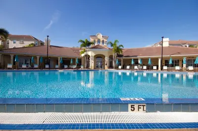 a large swimming pool in front of a building at Penthouse Utopia condo in Orlando