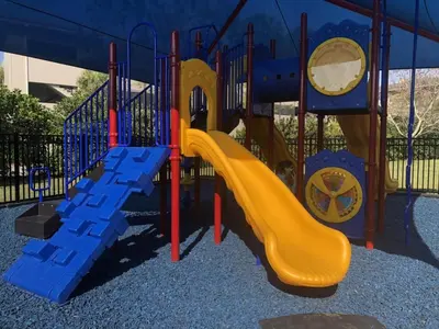 a playground with a slide in a park at Penthouse Utopia condo in Orlando