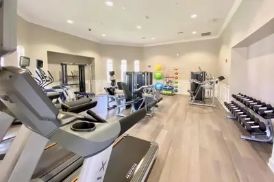 a gym with treadmills and elliptical machines at Vista Cay Magic condo in Orlando